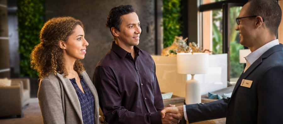 Couple speaking to a Lincoln Concierge representative