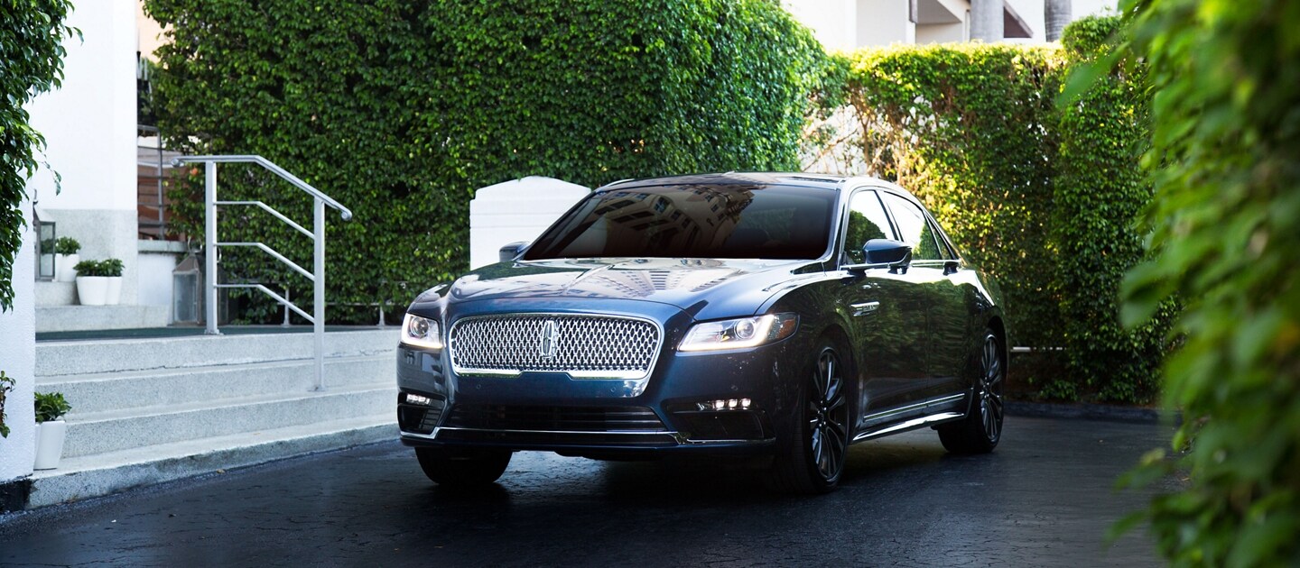 Lincoln Continental shown here in front of hotel