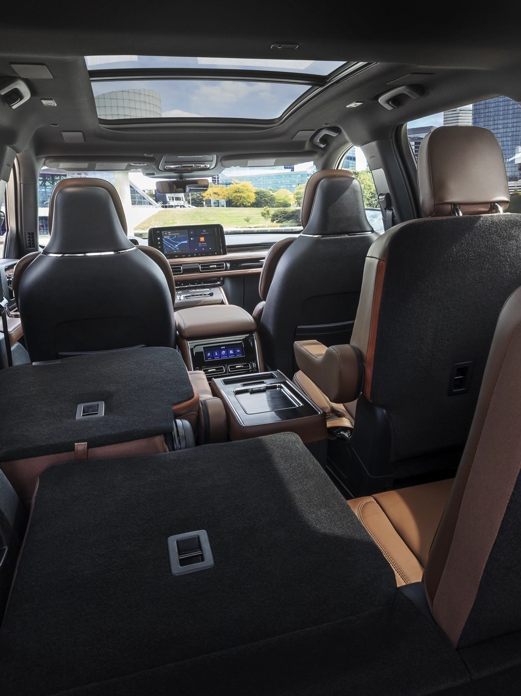 One side of the PowerFold® third-row seat and a second-row seat are folded forward in the 2025 Lincoln Aviator® SUV.