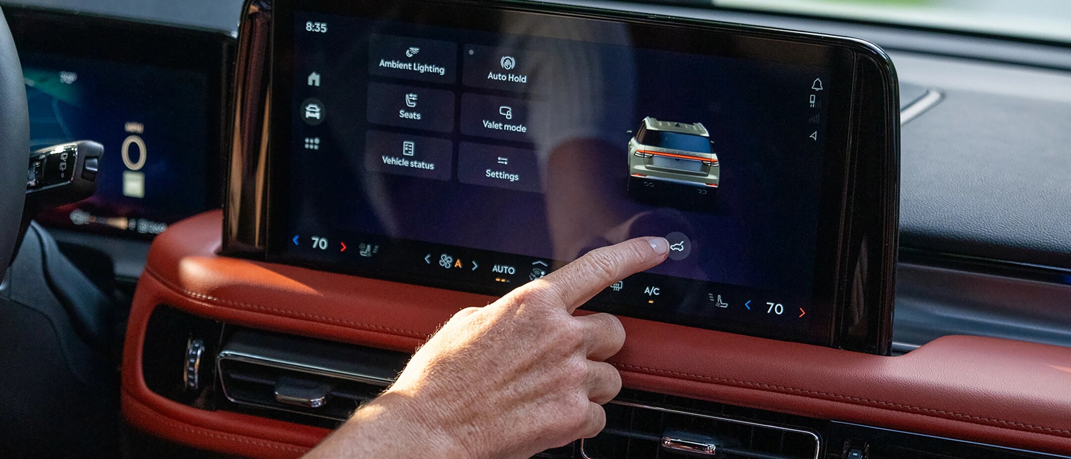 A man using the center touch screen.