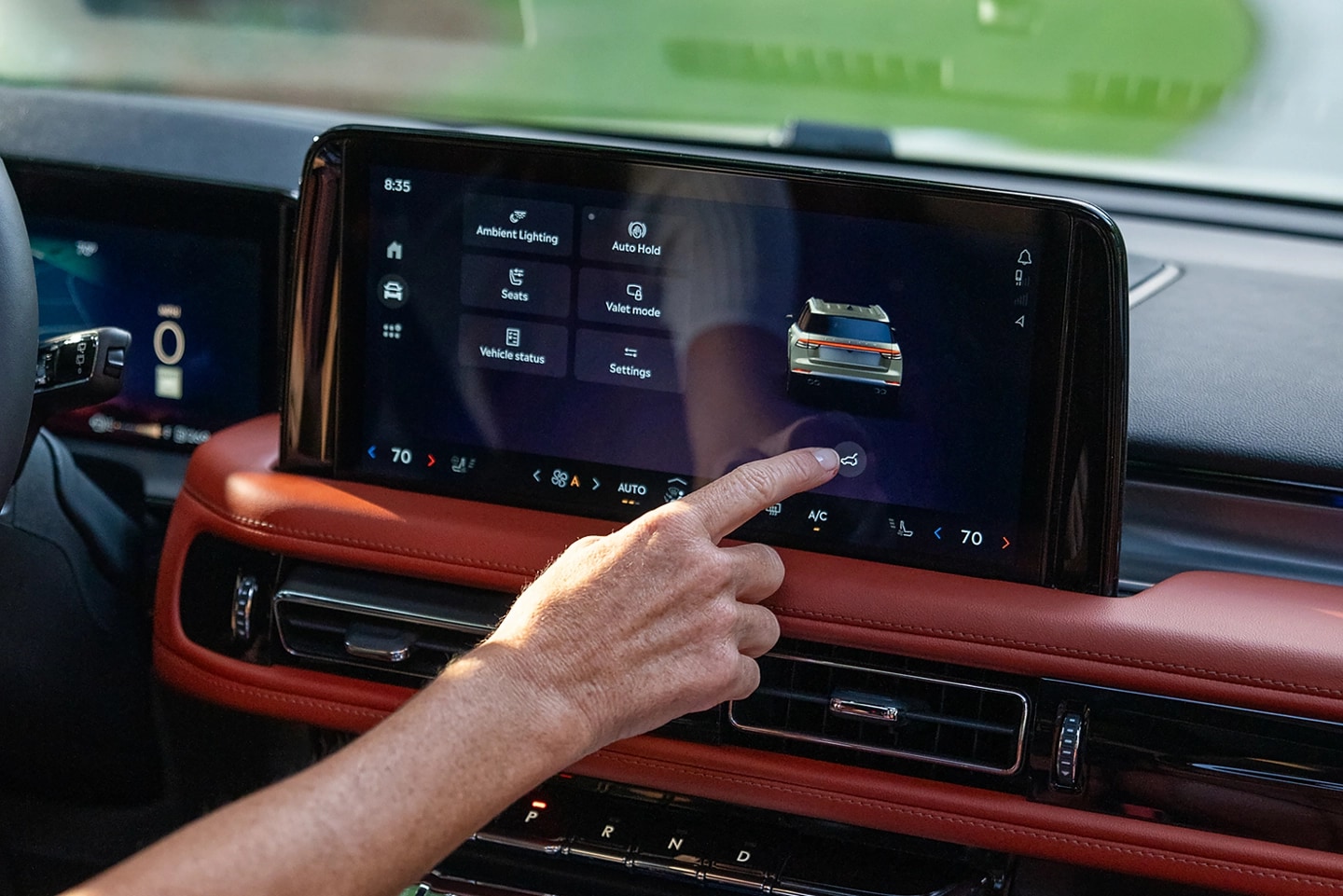 A man using the center touch screen.