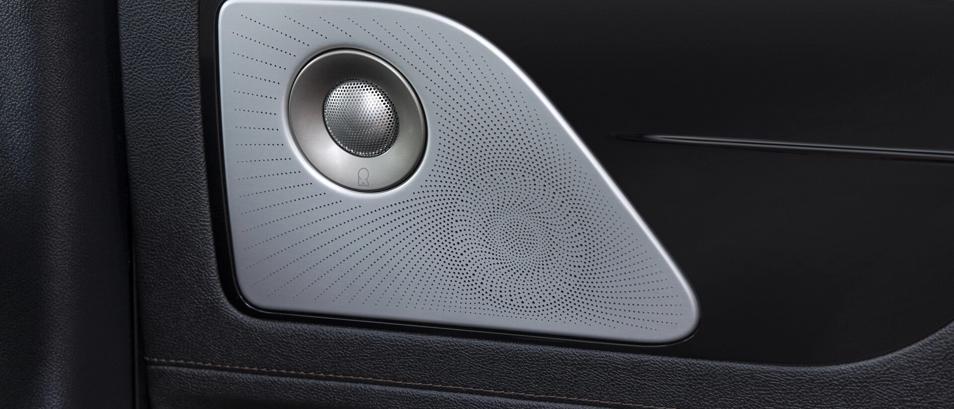 A Revel® speaker is shown on the interior door pane of a 2026 Lincoln Aviator® SUV