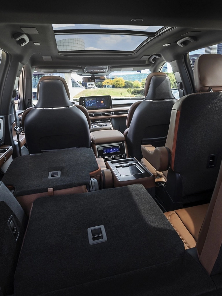 The interior of a 2026 Lincoln Aviator® SUV shown from the third row looking forward
