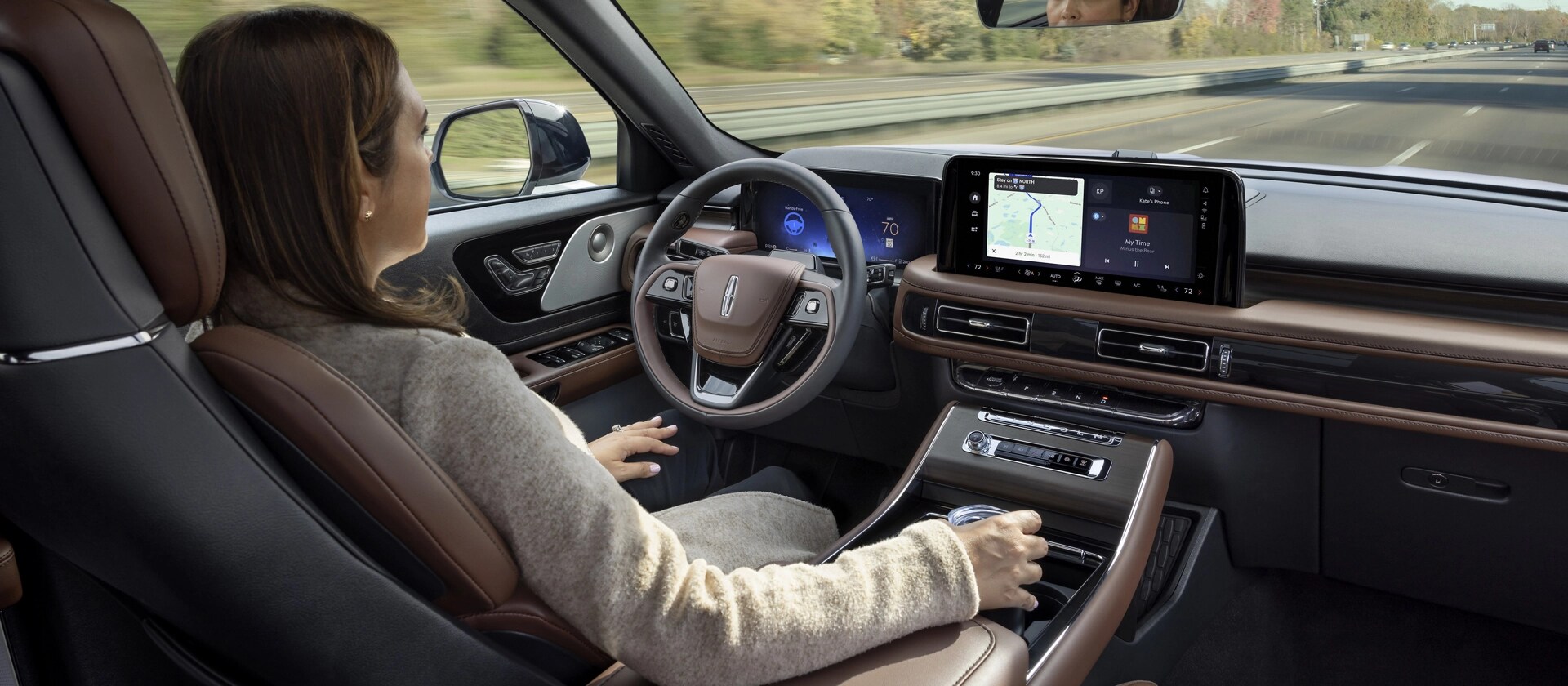 A 2026 Lincoln Aviator® SUV is being driven hands-free on a highway