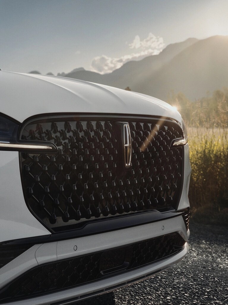 The Auto High Beam Headlamps of a 2026 Lincoln Aviator® SUV are illuminated