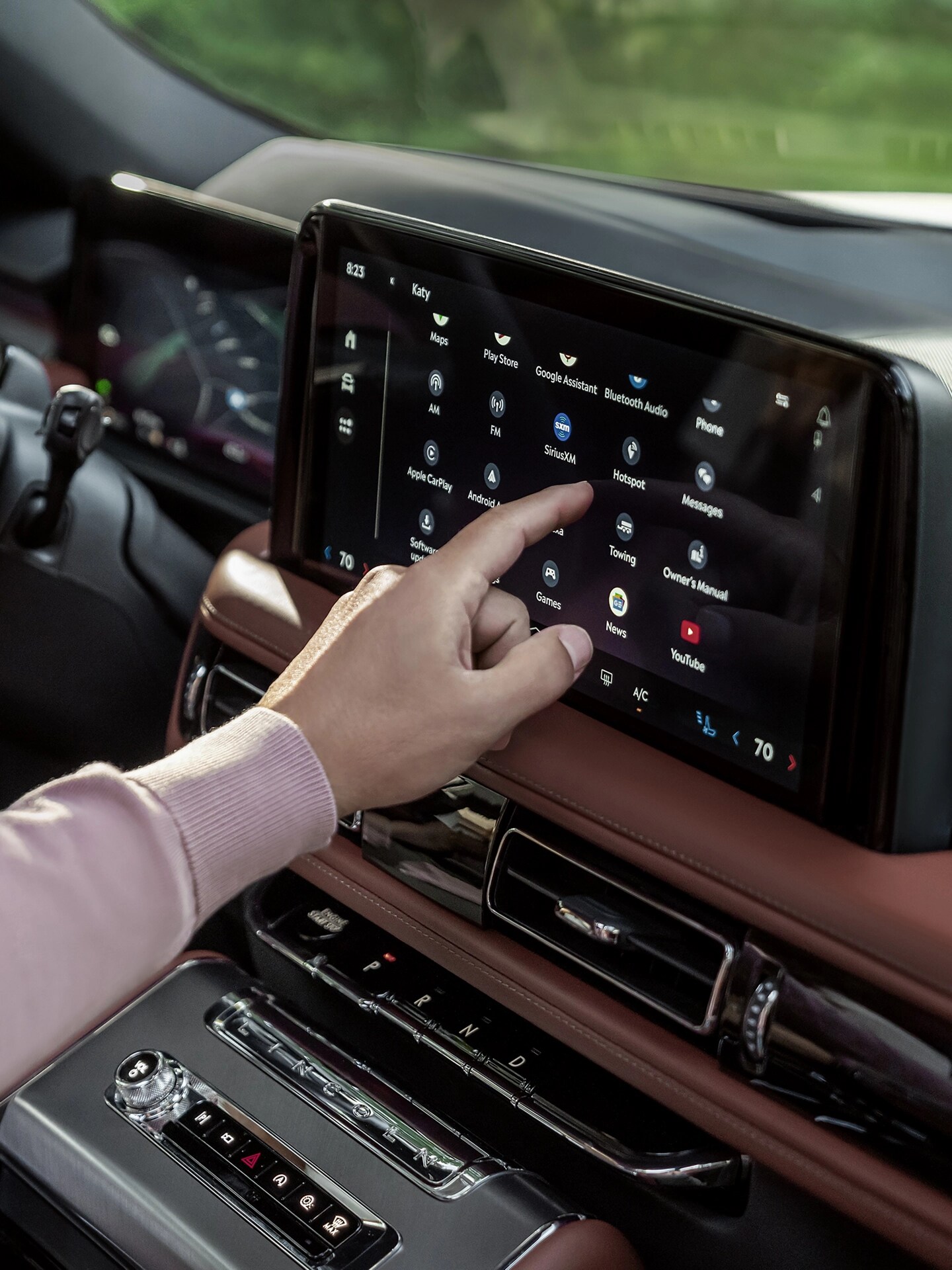 A man using the center touchscreen on his Lincoln Aviator