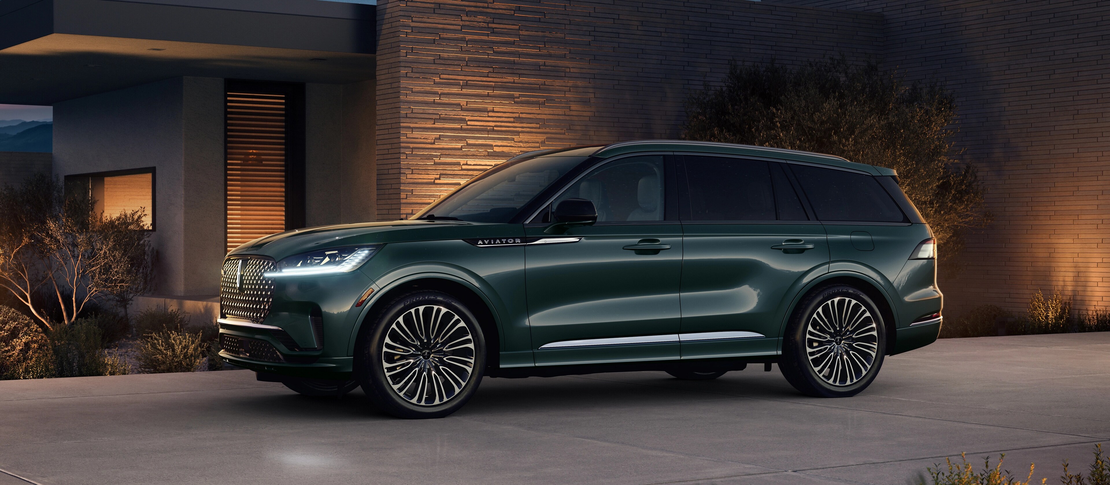 A 2026 Lincoln Black Label Aviator® SUV is parked in the driveway of modern home in the southwest