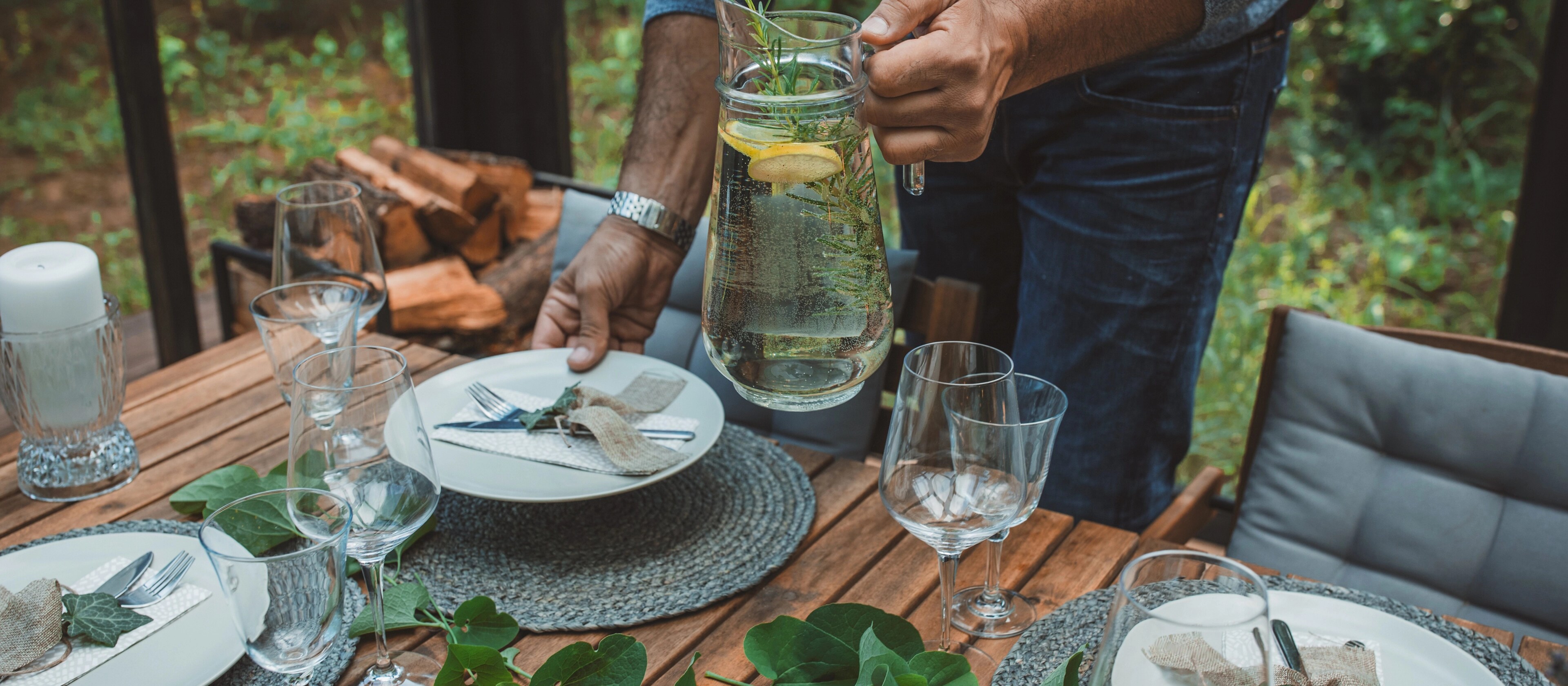 A dining table is being set to replicate the inspiration for the Lincoln Black Label invitation theme