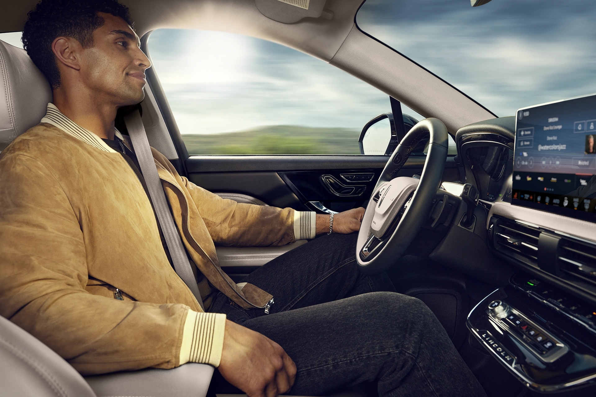 A man sitting in the driver seat of a 2025 Lincoln Corsair.