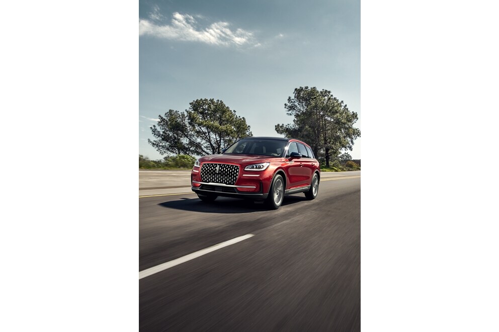 A 2026 Lincoln Corsair® SUV is being driven on a country road
