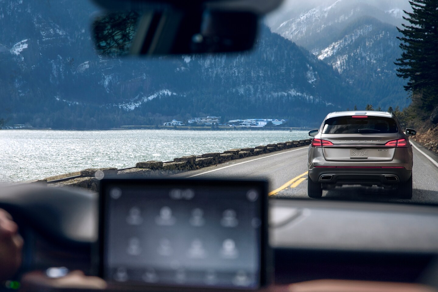 A rapidly braking vehicle is seen through the windshield of a 2023 Lincoln Aviator®