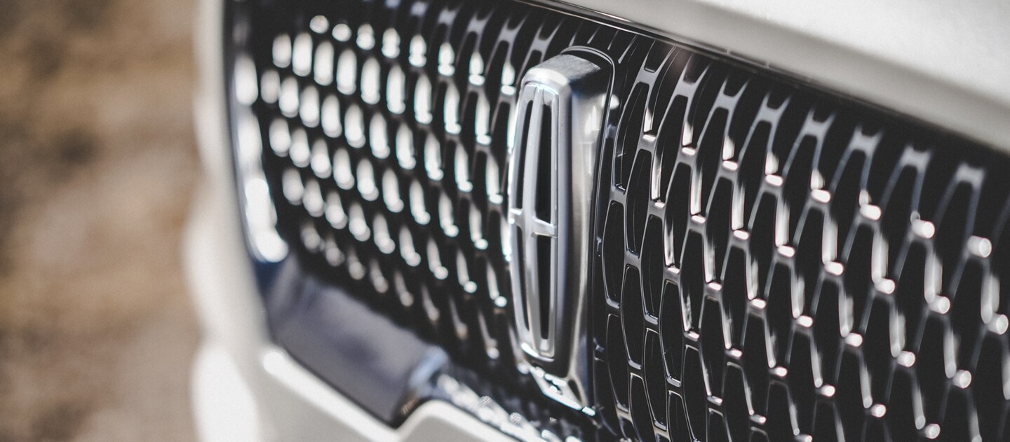 The grille of the 2023 Lincoln Aviator® Reserve model is shown, with an eye-catching repeated field of Lincoln Star shapes