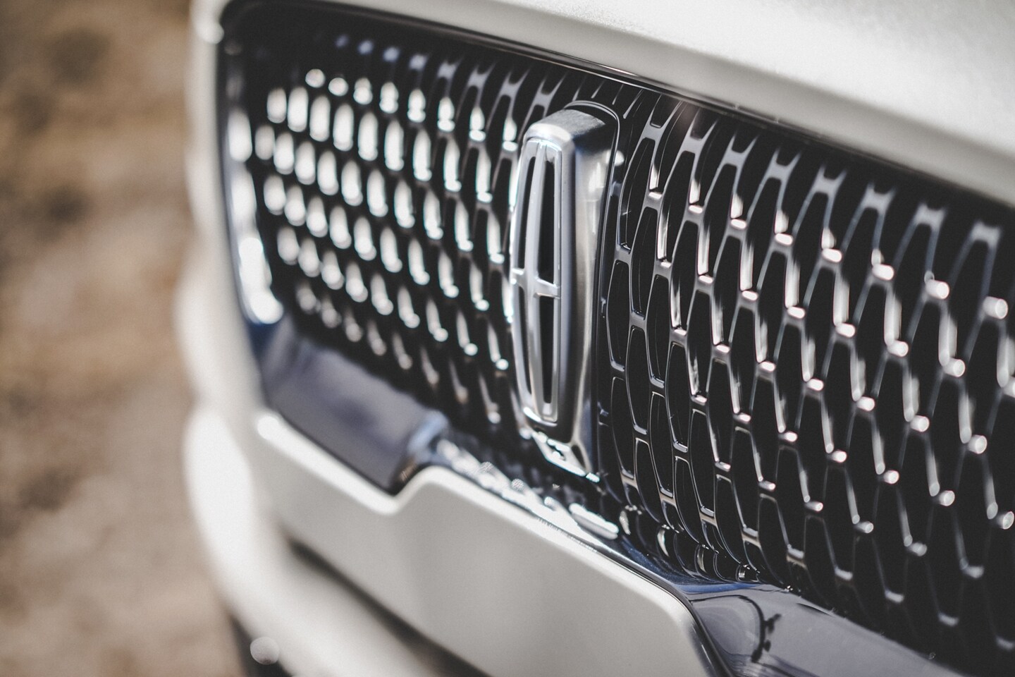 The 2023 Lincoln Navigator driving on a road.