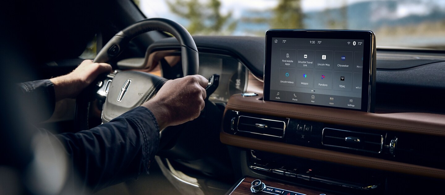 The Lincoln + Alexa App screen is displayed in the center touch screen of a 2023 Lincoln Aviator®