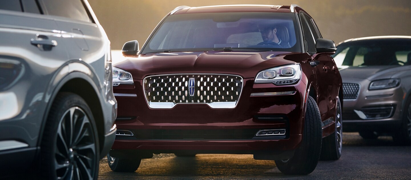 A 2023 Lincoln Aviator® Grand Touring is shown using the available Active Park Assist 2.0 system