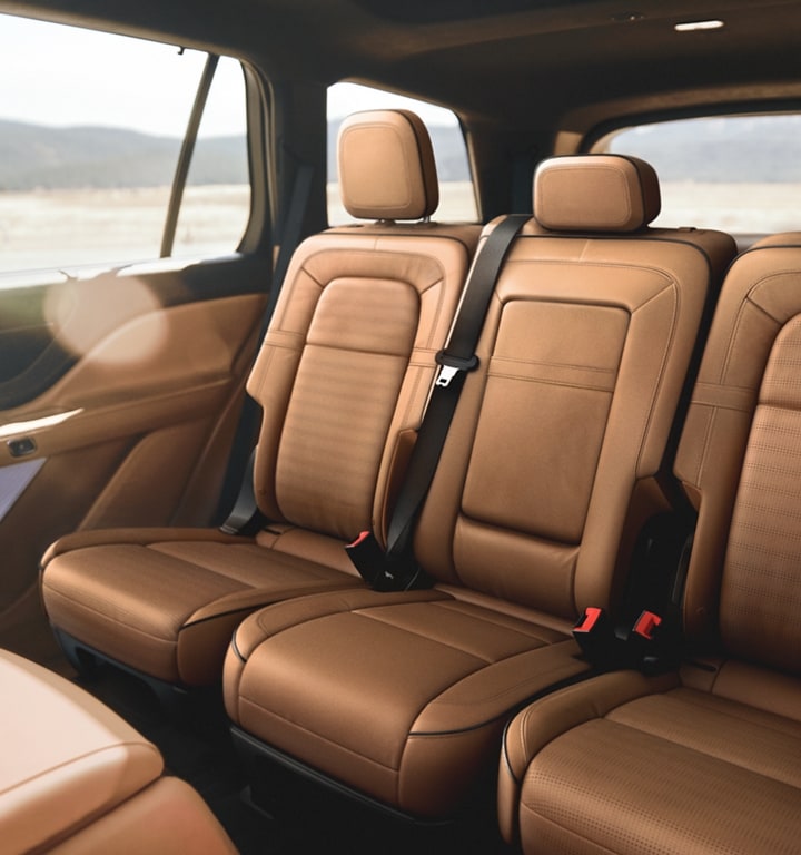 The second row of a 2023 Lincoln Aviator® is shown with the optional center console positioned
