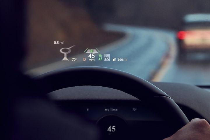 Vital information in the head up display is shown being projected on the windshield of a 2023 Lincoln Aviator®