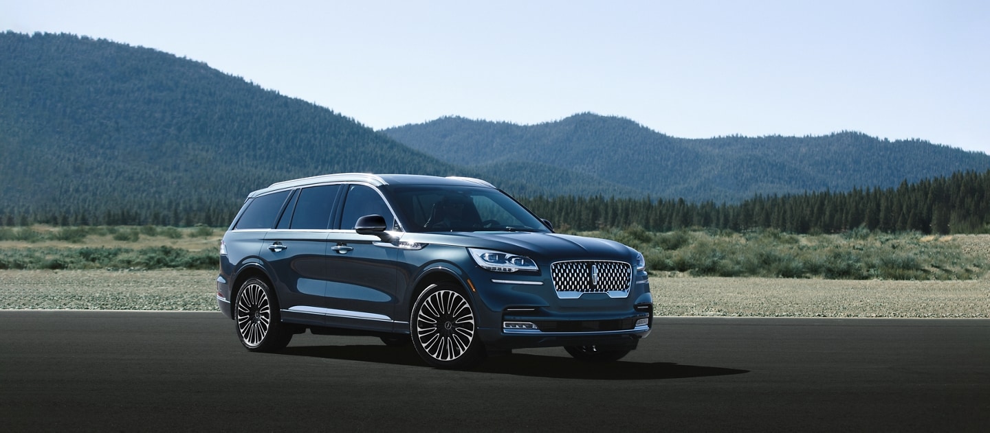 A 2024 Lincoln Aviator® is being driven on a mountain road