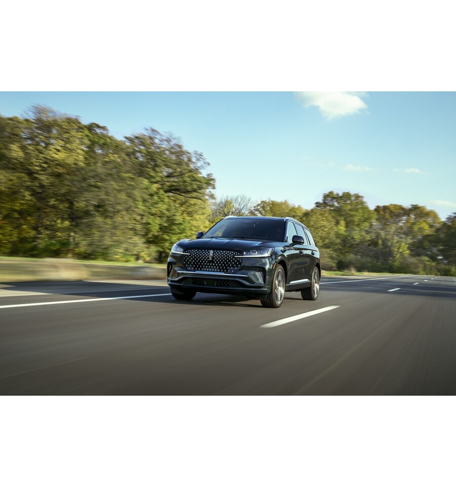 A 2025 Lincoln Aviator® is shown being driven along river valley