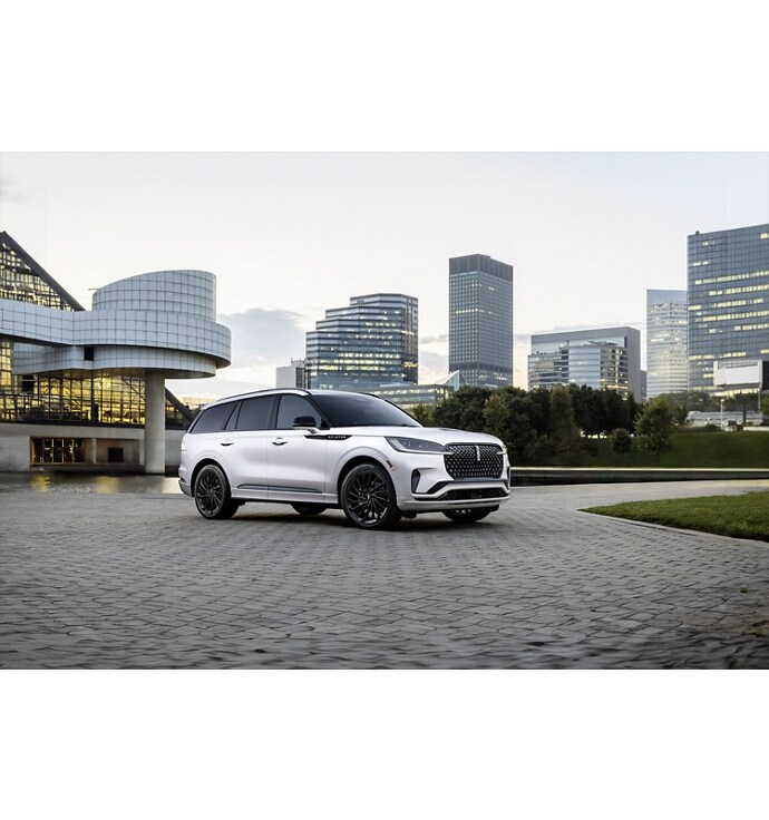 A 2025 Lincoln Black Label Aviator® SUV is shown in an urban setting.