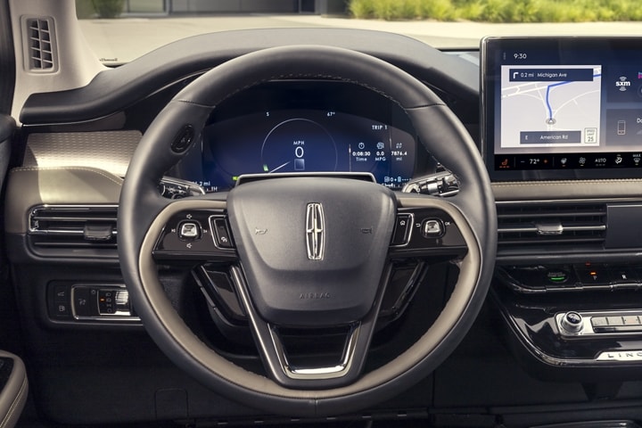 A friendly alert is displayed in the digital cluster behind the steering wheel inside a 2023 Lincoln Corsair® SUV