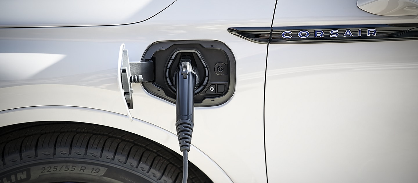A Mobile Power Cord is shown plugged into a 2023 Lincoln Corsair® Plug-in Hybrid as it charges