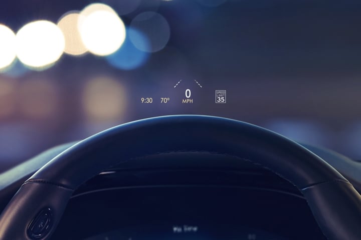 The head-up display projects data on the windshield above the steering wheel inside a 2023 Lincoln Corsair® SUV