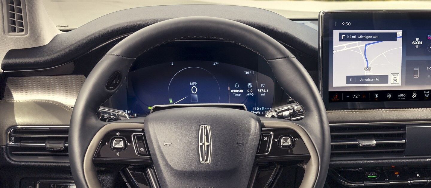 A considerate prompt alert is displayed in the digital cluster behind the steering wheel inside a 2024 Lincoln Corsair® SUV