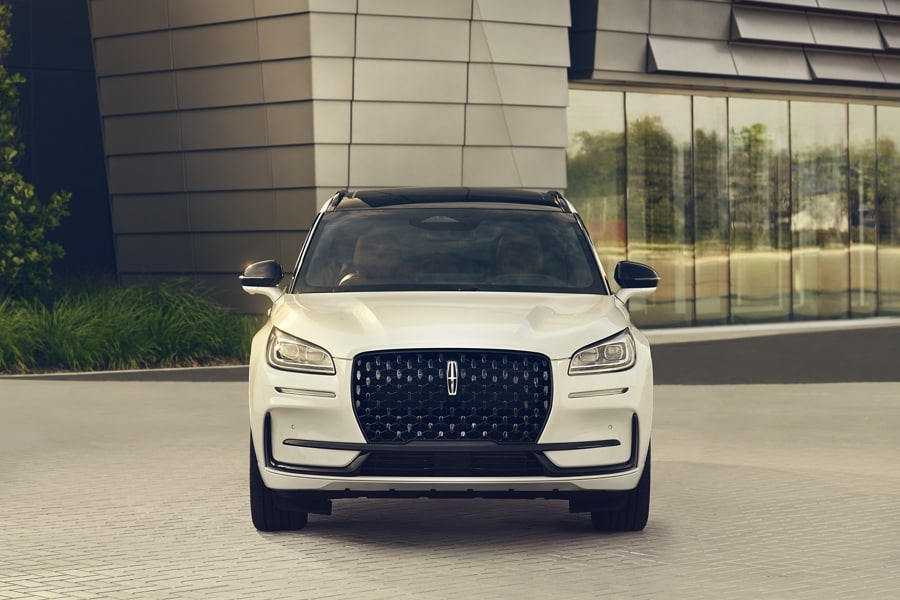 The dazzling LED headlamps of a 2024 Lincoln Corsair® SUV sparkle in the sunlight