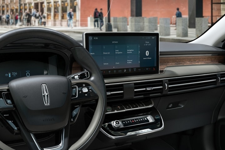 The center screen inside a 2024 Lincoln Corsair® SUV shows a home screen of SYNC® 4