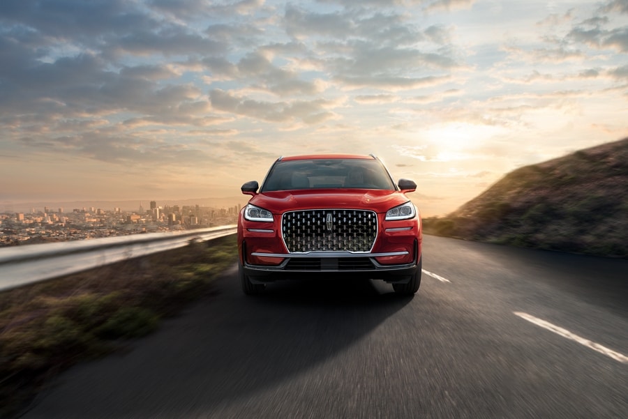 A 2024 Lincoln Corsair® SUV is shown being driven on a hillside road
