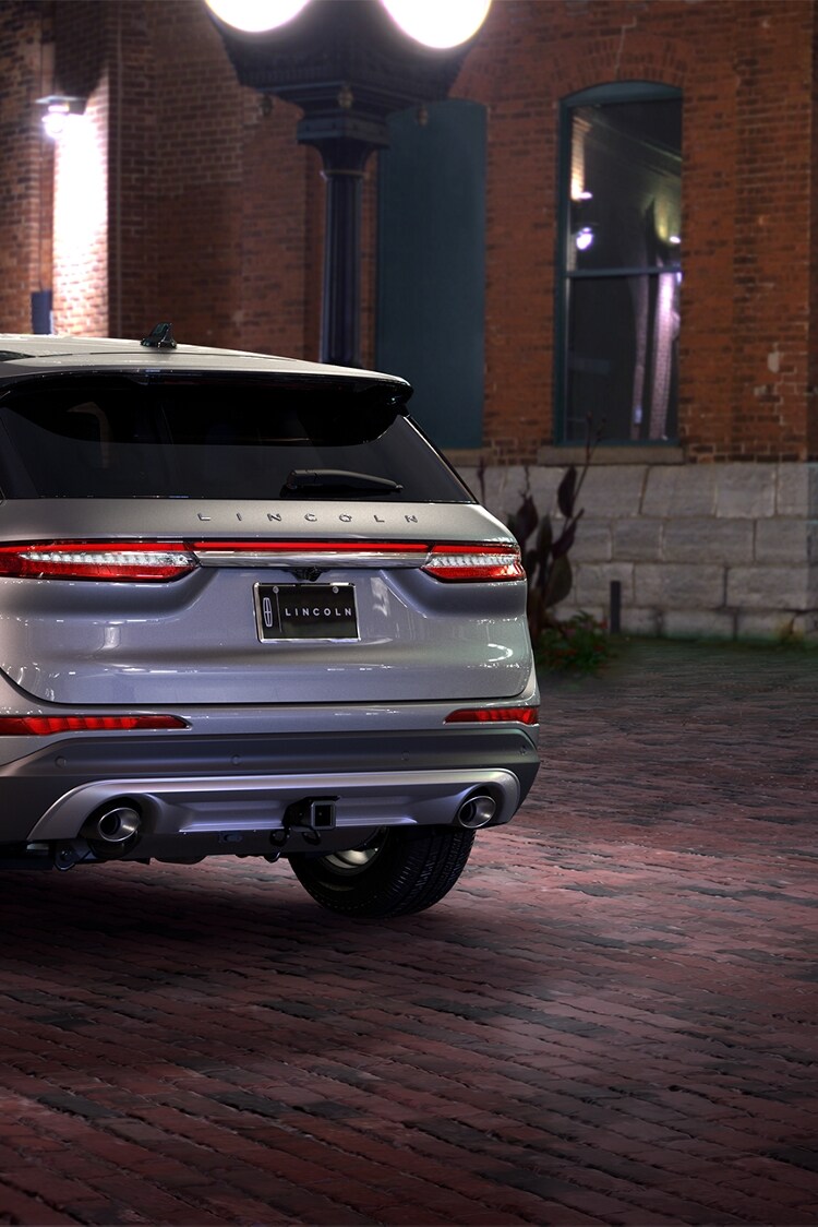 Rear view of a silver Lincoln Corsair SUV highlighting its towing capabilities