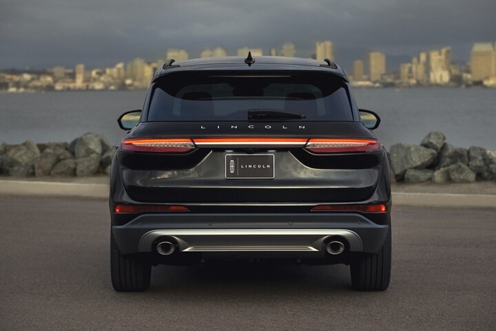 The rear of a 2025 Lincoln Corsair® SUV is shown with the LED light bar illuminated