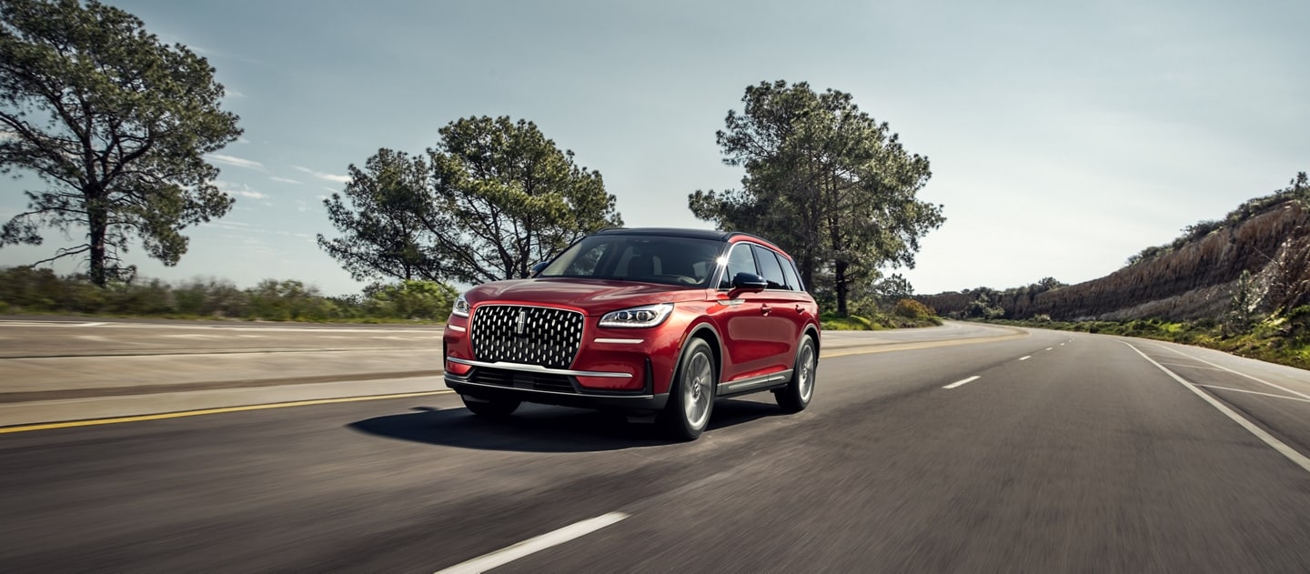 A 2025 Lincoln Corsair® Reserve model is being driven on a remote highway