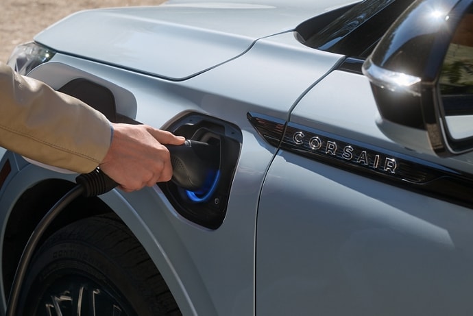 A person charging their 2025 Lincoln Corsair Grand Touring.