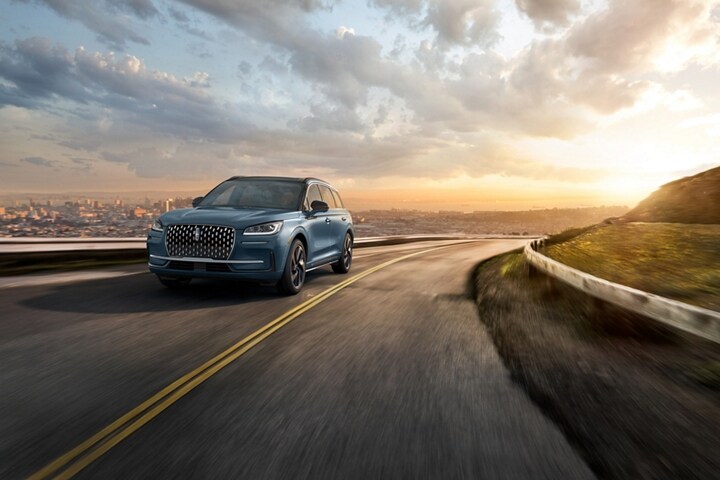 The stylish grille, unique to the 2025 Lincoln Corsair® Grand Touring Plug-in Hybrid glistens in the sunlight