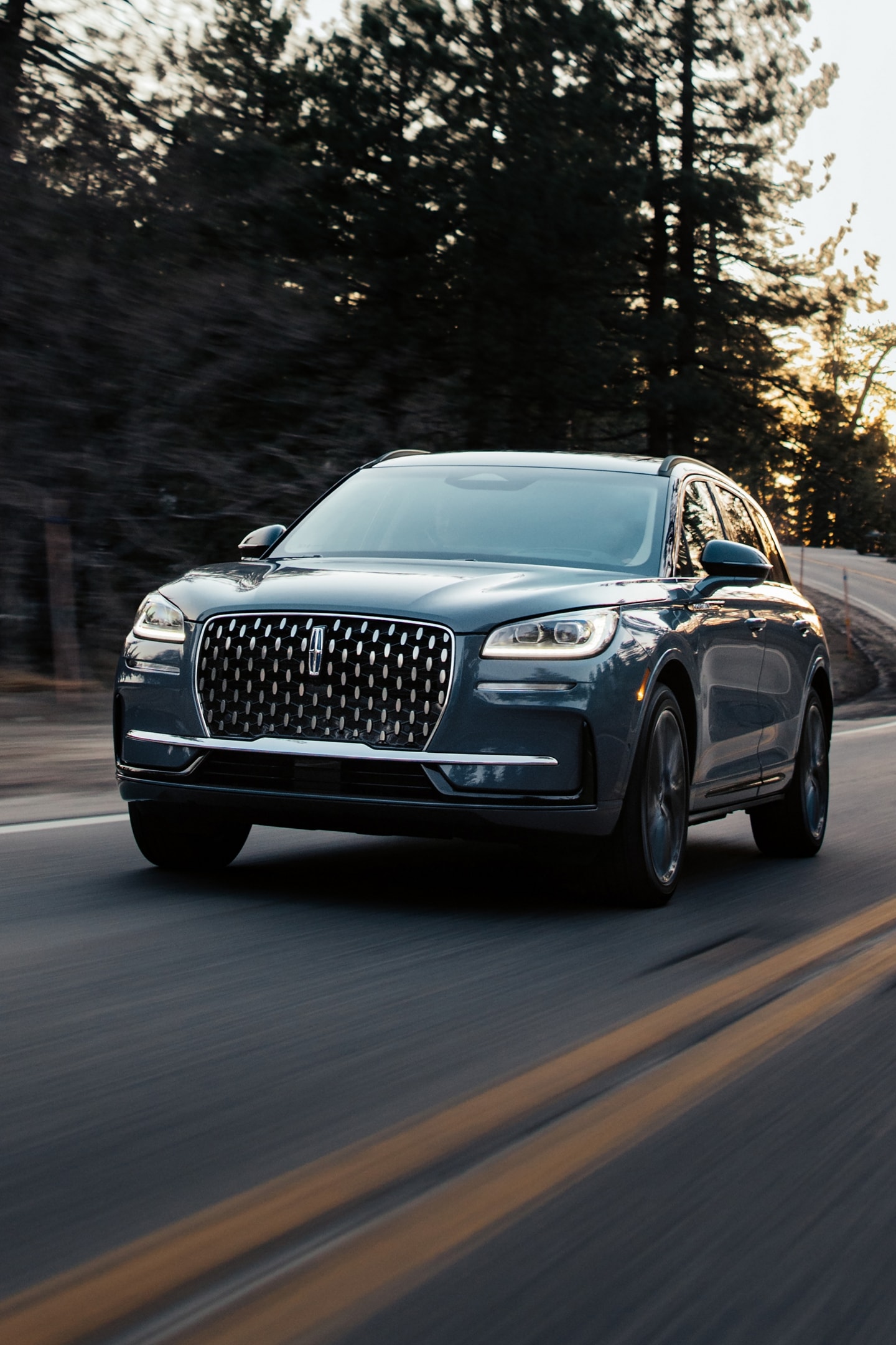 The jewel-like headlamps of a 2025 Lincoln Corsair® SUV emit a concise array of light