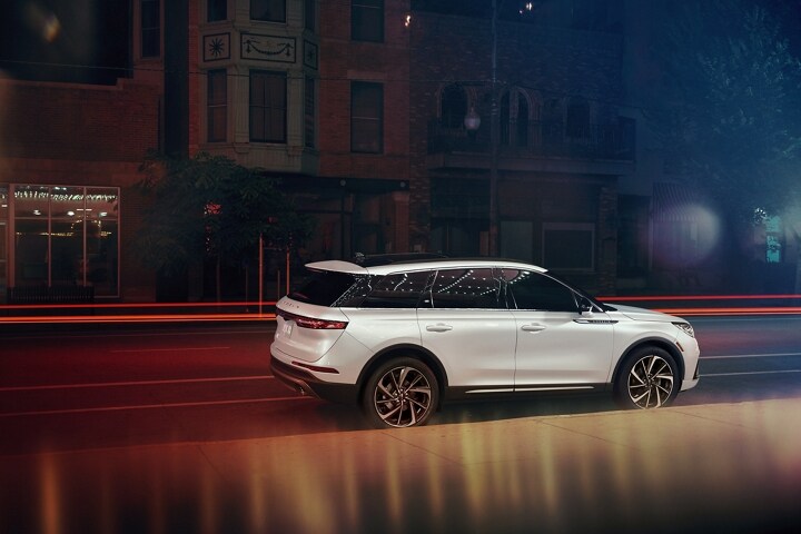 A 2025 Lincoln Corsair® Reserve model is parked in a city setting at night