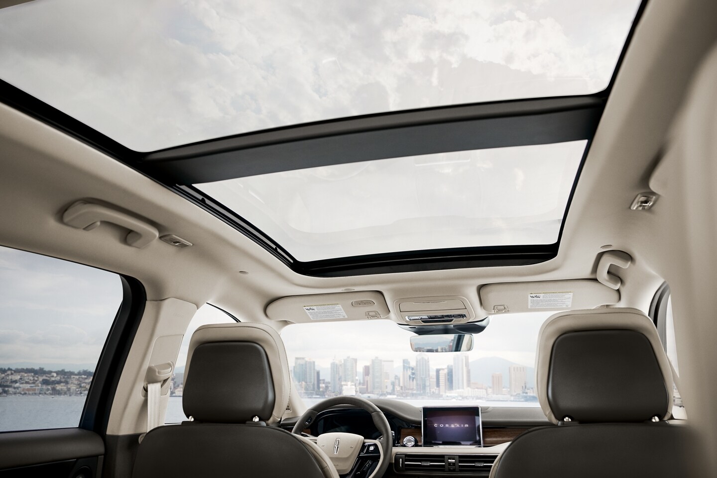 The available panoramic Vista Roof® is shown from inside a 2026 Lincoln Corsair® SUV