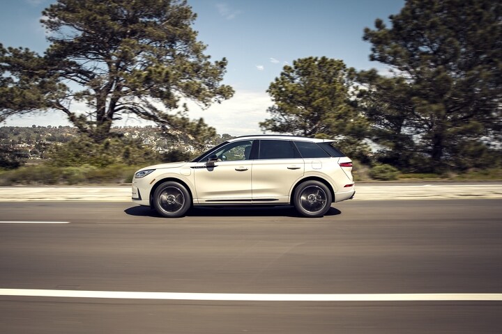 2026 Lincoln Corsair® Grand Touring plug-in hybrid SUV is being driven in the countryside