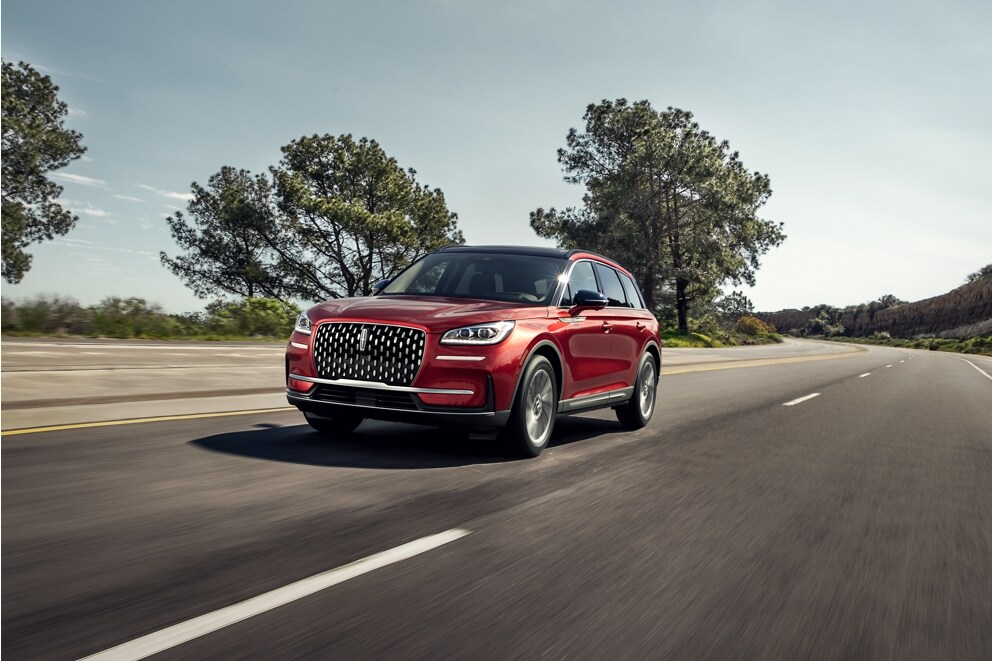 A 2026 Lincoln Corsair® SUV is being driven on a countryside road
