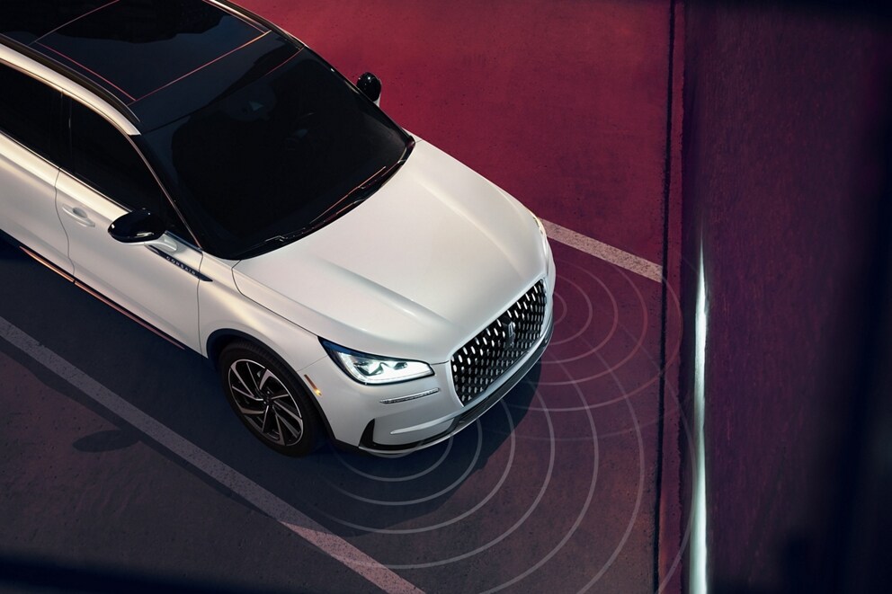 Simulated sensing waves emit from a 2026 Lincoln Corsair® SUV to demonstrate Pre-Collision Assist