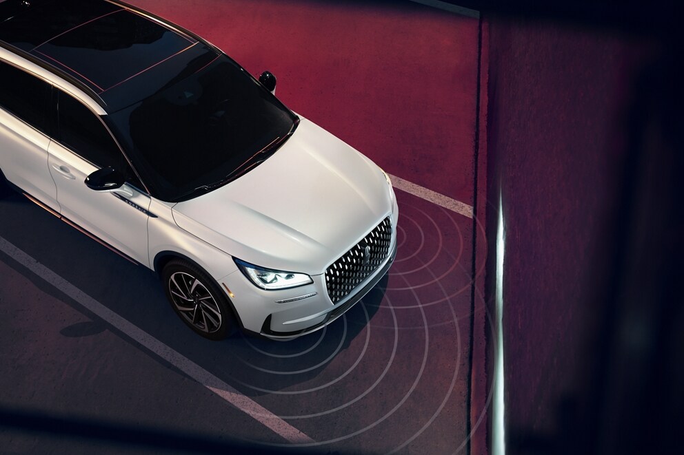 Simulated sensing waves emit from a 2026 Lincoln Corsair® SUV to demonstrate Pre-Collision Assist