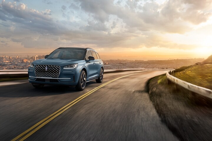 The stylish grille, unique to the 2026 Lincoln Corsair® Grand Touring Plug-in Hybrid, glistens in the sunlight
