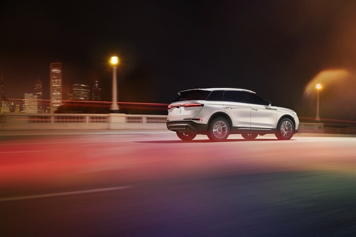 A 2026 Lincoln Corsair® Reserve model is being driven on a highway at night