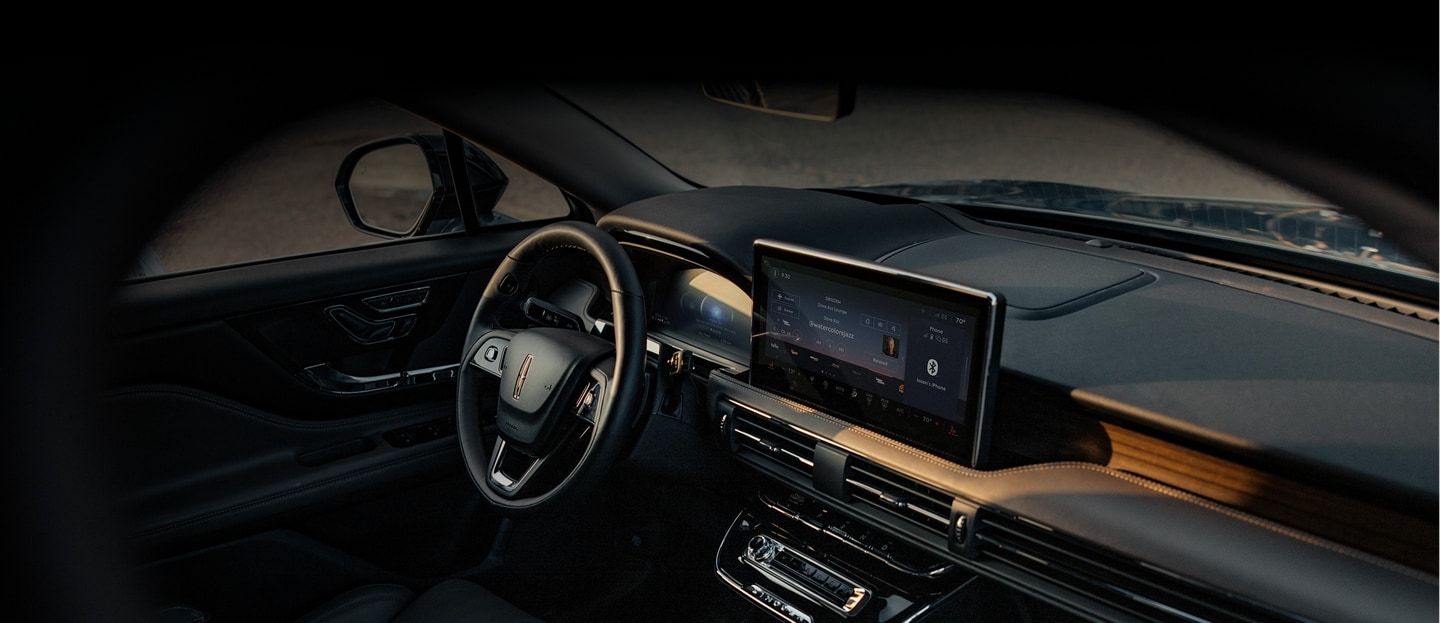 Interior view of the 2025 Lincoln Corsair Grand Touring, highlighting the dashboard, steering wheel, and digital displays