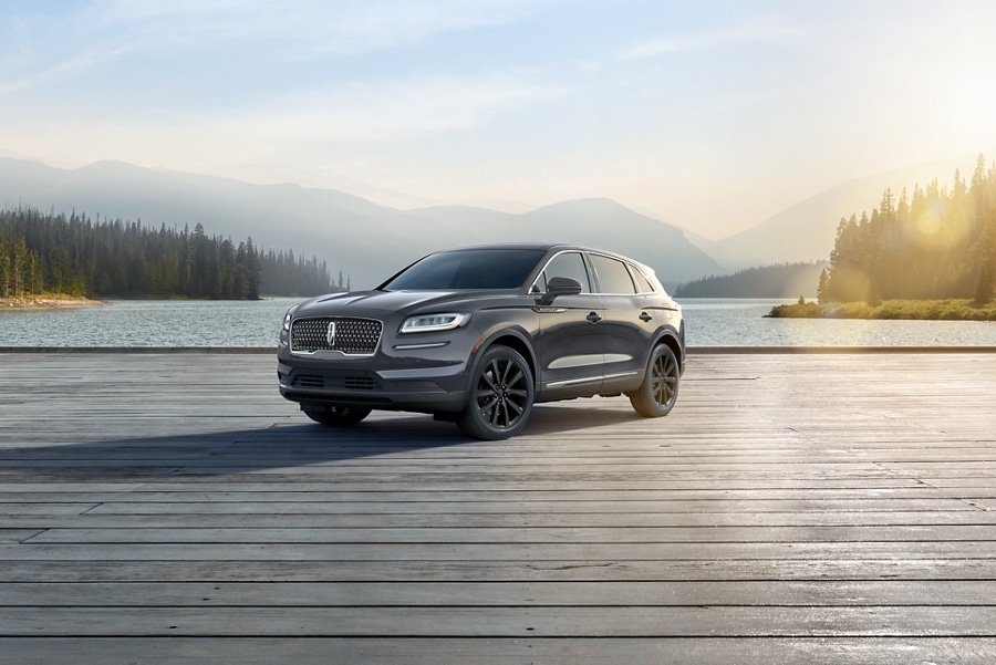 A 2023 Lincoln Nautilus® SUV is shown with sunlight accentuating the seamless design of the Monochromatic Package