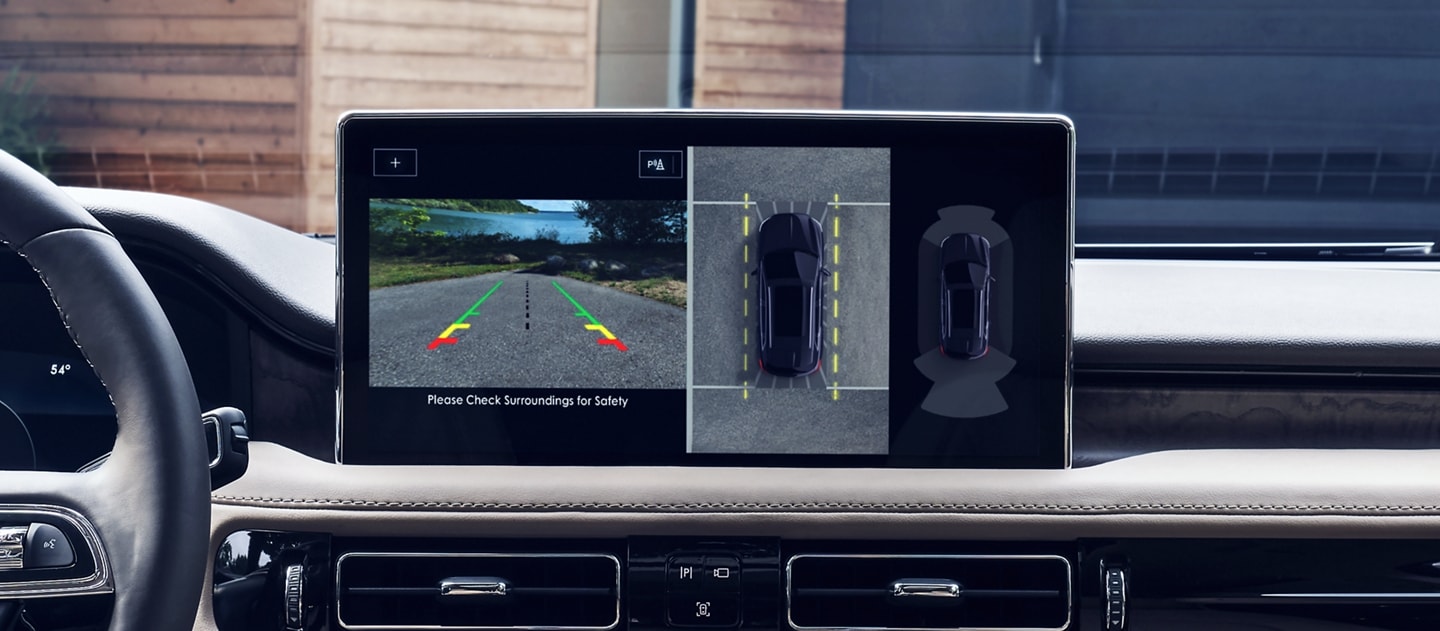The center touchscreen displays the surrounding area of a 2023 Lincoln Nautilus® SUV via the available 360-degree camera