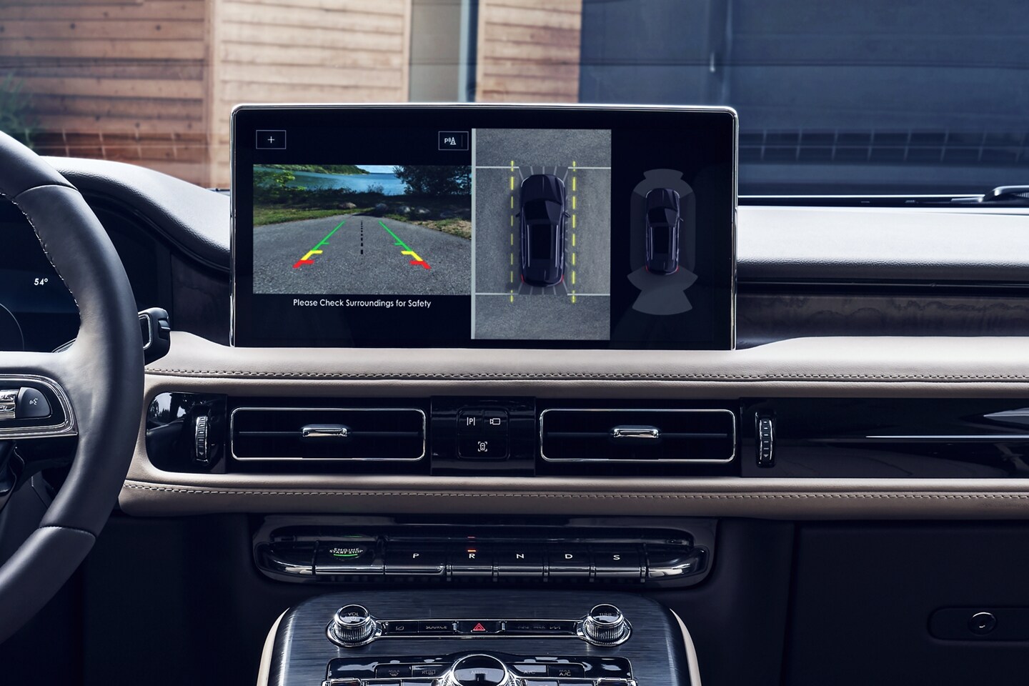 The center touchscreen displays the surrounding area of a 2023 Lincoln Nautilus® SUV via the available 360-degree camera
