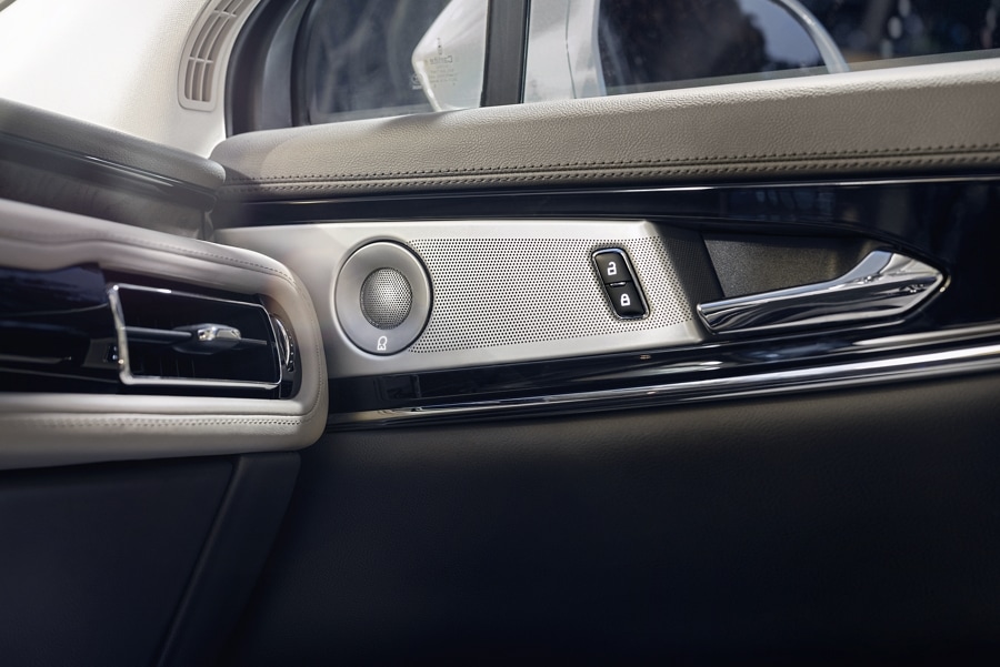 A close up view of one of the sound system speakers is shown in the door of the 2023 Lincoln Nautilus® SUV